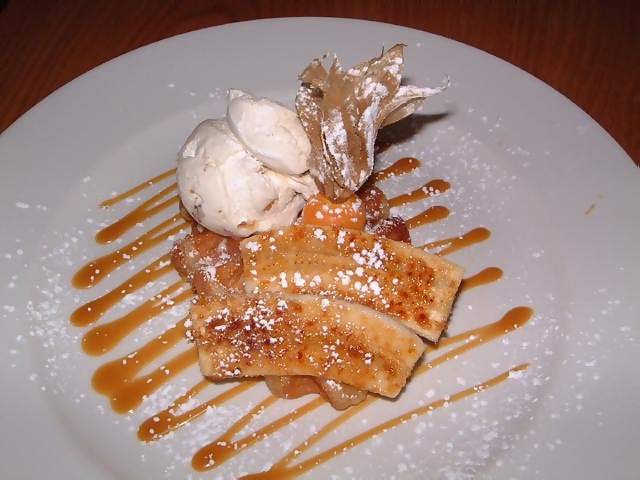 Food Belgian waffle with caremilsed banana and caramel sauce