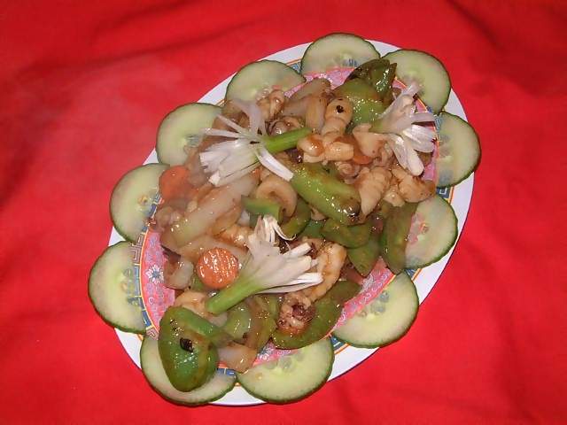 Food Chinese meal of squid in black bean sauce with green pepper and onions