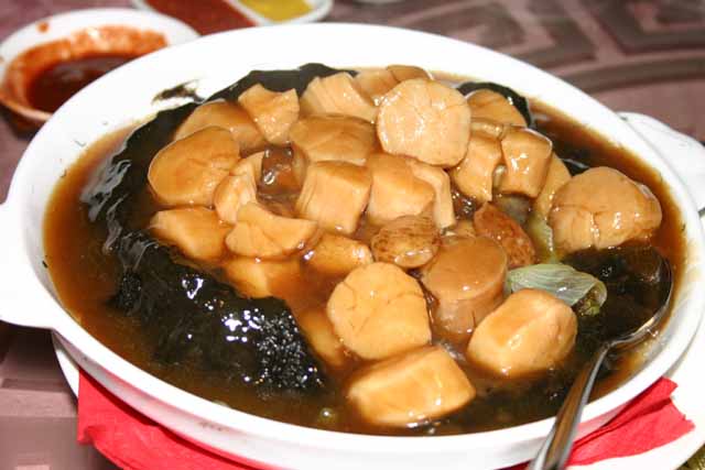 Food Scallops in a Chinese stew with mushrooms vegatables and seaweed