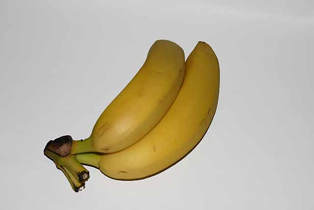 Fruit Two bright yellow bananas