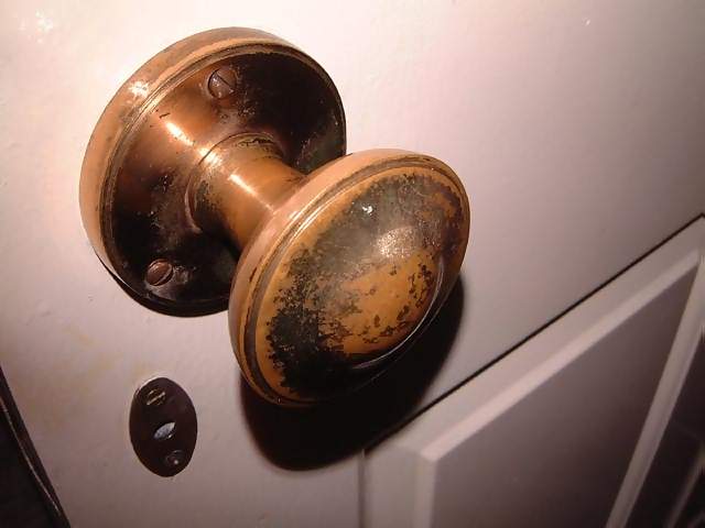Household Closeup of worn brass door knob