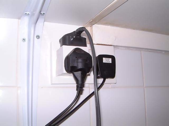 Miscellaneous Double plug with adapter socket holding three black plugs