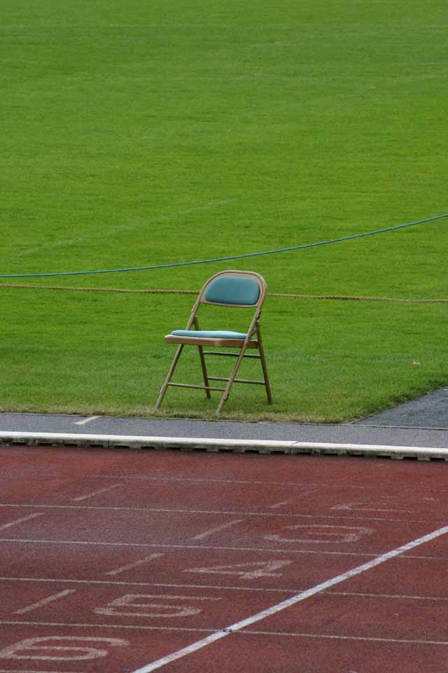 Miscellaneous Photo of empty chair overlooking the finish line on a running track