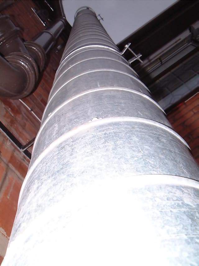 Miscellaneous View up tall steel chimney in a Chinese Chippy