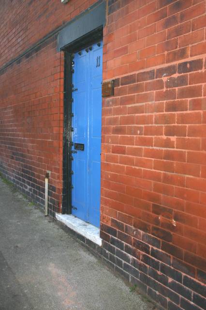 Blue Door in the Side of a House
